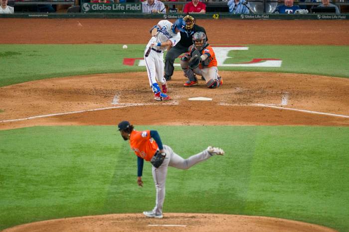 Oct 18, 2023; Arlington, Texas, USA; Texas Rangers left fielder Evan Carter (32) hits a double against Houston Astros starting pitcher Cristian Javier (53) during game three of the ALCS for the 2023 MLB playoffs at Globe Life Field. Mandatory Credit: Jerome Miron-USA TODAY Sports
